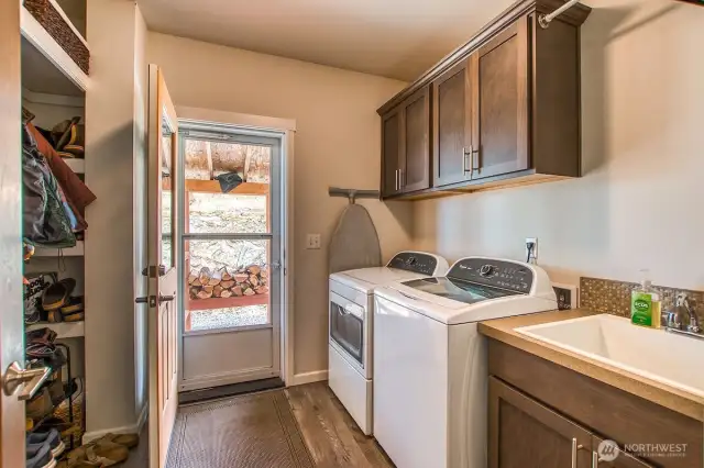 Spacious laundry room with lots of storage.