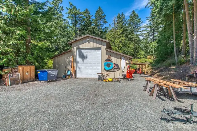 Center bay of the shop/barn has a 14' door for boat or RV storage.