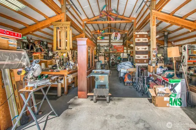 She interior with built-in cabinetry, wood burning stove, propane heat.