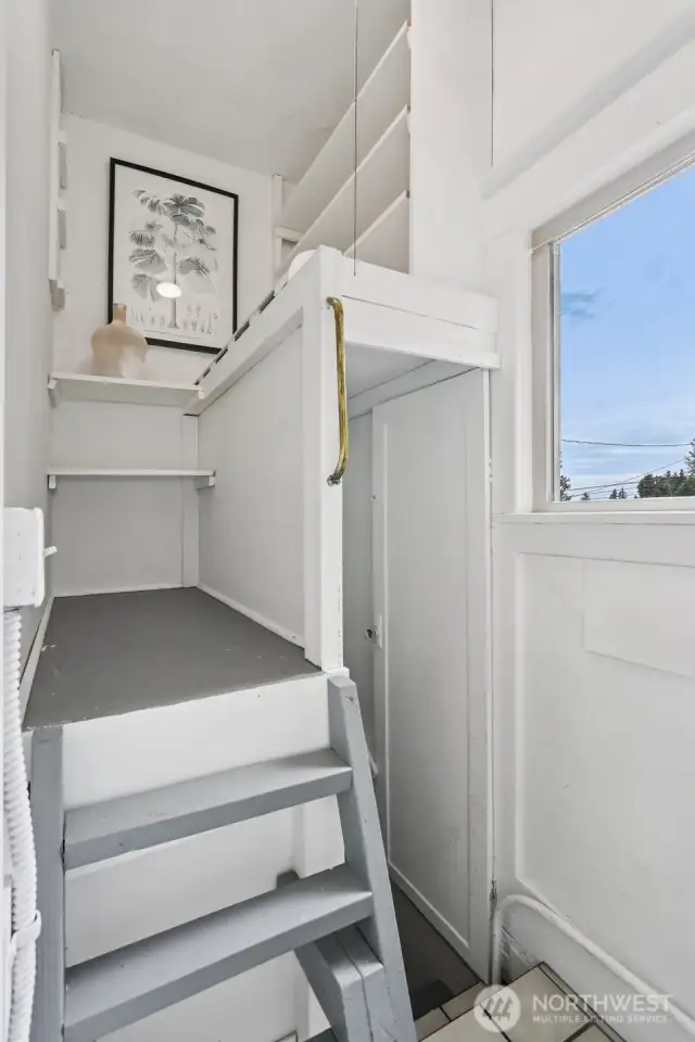 Cutest little pantry just off the kitchen is such a brilliant use of space! Stairs lead to the mostly finished basement