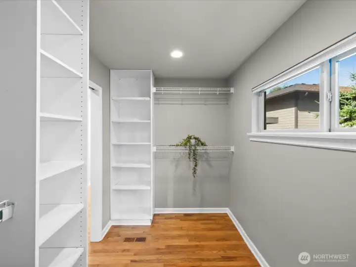 Another view of primary bedroom walk in closet