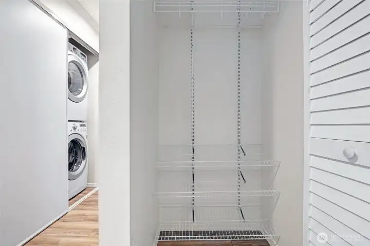 Entryway coat closet with built-in shelving.