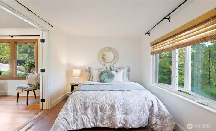 The second main-floor bedroom offers its own private ¾ ensuite, making it ideal for guests or everyday convenience. Comfortable and well-appointed, it’s a space that blends practicality with easy livability.