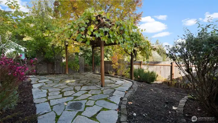 Down in the lower side yard, discover your own private oasis! Lush, peaceful, and full of charm, it’s a sweet hideaway that feels worlds away from it all.