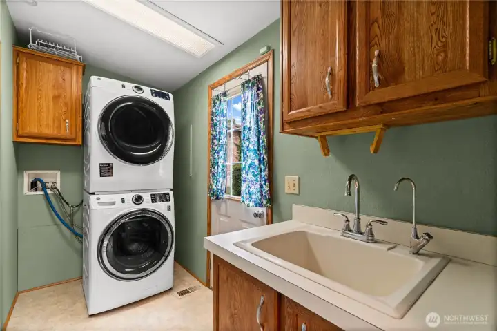 Laundry/utility room with access to side yard and deck.