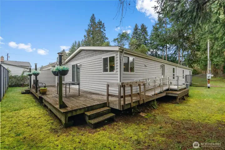 Wrap around deck with doors to home on 3 sides of the house.