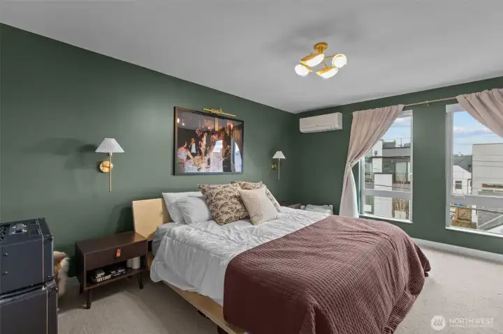 Moody primary bedroom with trending gold accents.