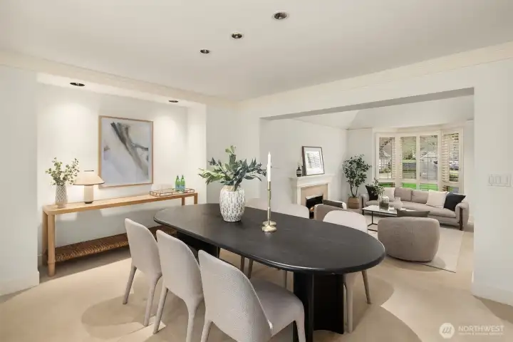 The main level flows effortlessly from the living and dining areas to the well-appointed kitchen, ideal for both everyday living and entertaining.