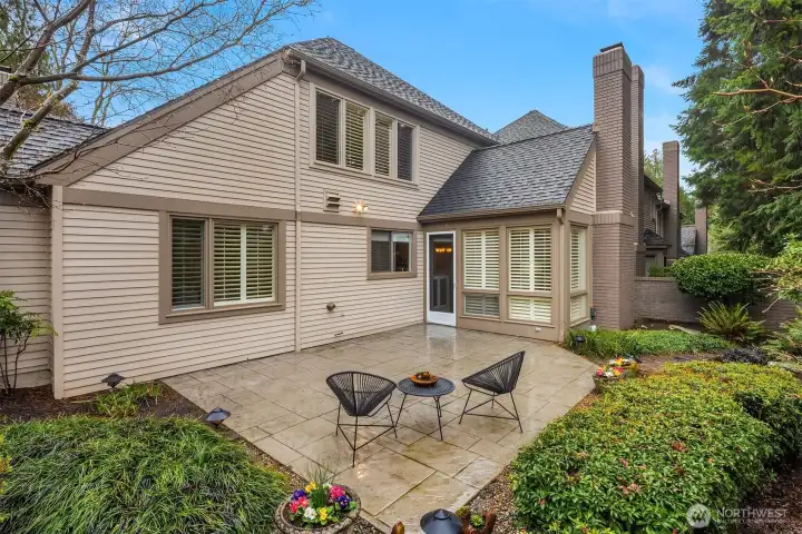 Enjoy your own private patio framed by lush landscaping, perfect for quiet mornings or outdoor dining.