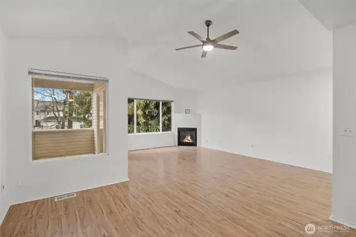 From the dining room to the living room. New flooring and paint throughout!
