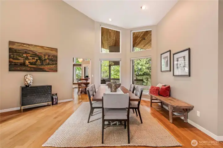 This versatile space can be a separate living room or used as it is currently. With well-maintained hardwood floors throughout and floor to ceiling windows, it can be styled to be elegant or cozy, flowing seamlessly into the landscape outside. This versatile space can be a separate living room or used as it is currently. With well-maintained hardwood floors throughout and floor to ceiling windows, it can be styled to be elegant or cozy, flowing seamlessly into the landscape outside.