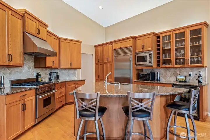 The kitchen is a chef's dream with beautiful finishes and high end appliances. The kitchen is a chef's dream with beautiful finishes and high end appliances.