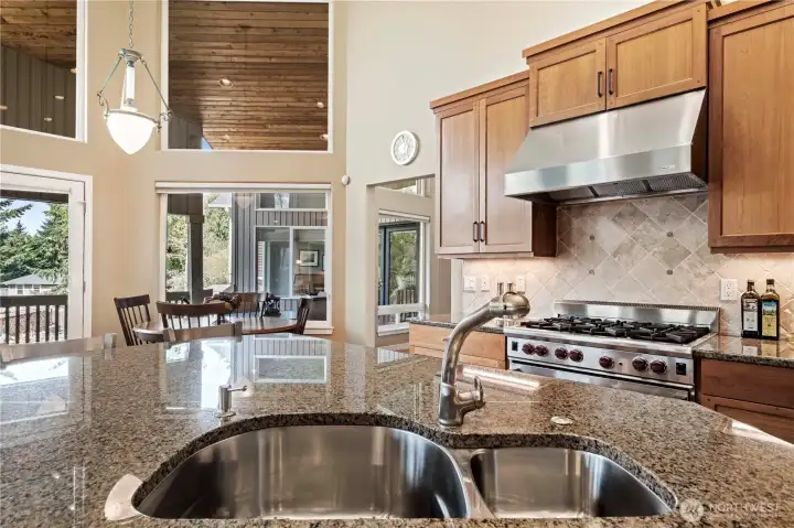 Notice how the gourmet kitchen flows easily into the dining area. All areas of the great room (kitchen, dining and family room) have amazing territorial views. Notice how the gourmet kitchen flows easily into the dining area. All areas of the great room (kitchen, dining and family room) have amazing territorial views.