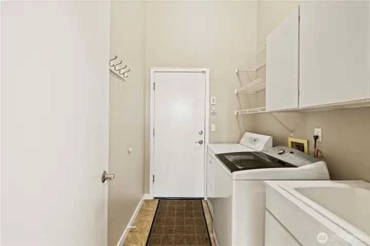 The oversized laundry room leads into the garage and has ample storage so it can be used as a mud room - a necessity for the Northwest.