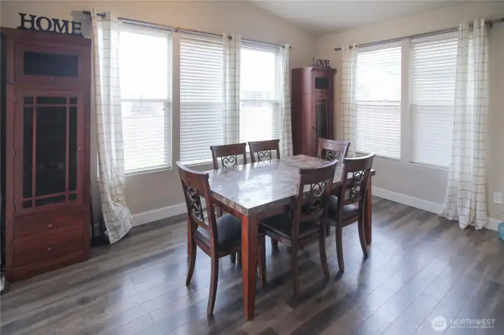 Large windows fill the dining room with light.