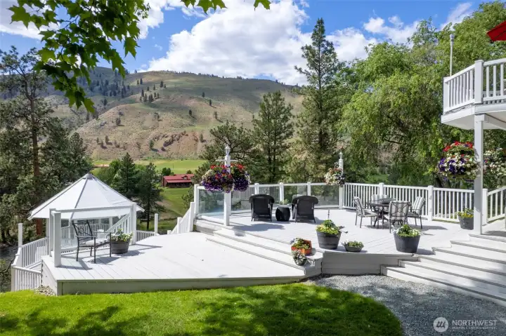 A classic river estate overlooking the Methow River, where expansive decks, a riverside gazebo, and sweeping mountain views create an unforgettable setting for gathering, entertaining, and making memories for generations to come.