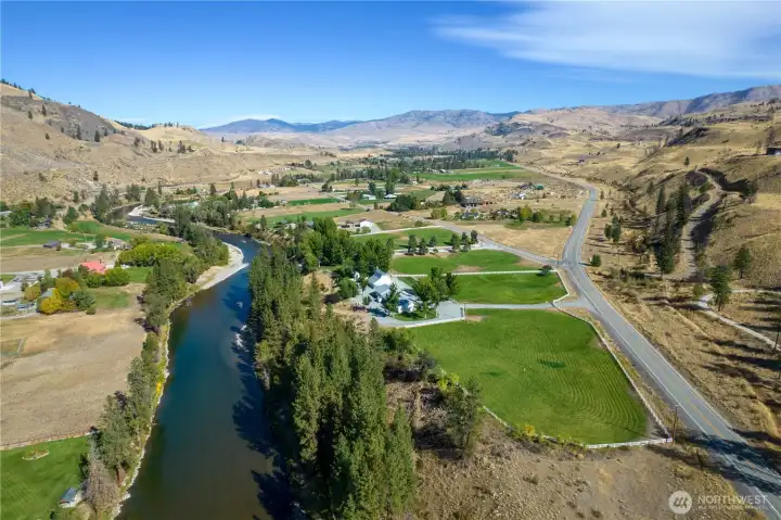 Looking upriver from above Marble Ranch—an extraordinary legacy property with sweeping Methow Valley vistas, fenced pasture, riverside forest, and room to live, work, and roam.