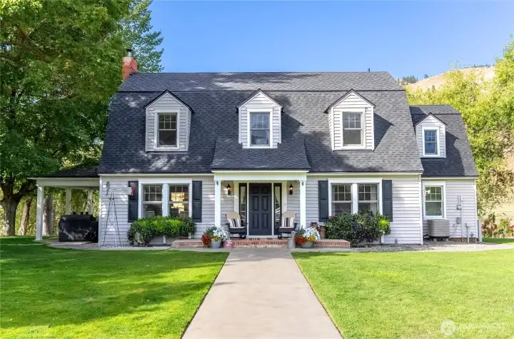 "Beyond the white fences and towering shade trees, a timeless farmhouse stands at the heart of one of the Methow Valley's most cherished riverfront settings."