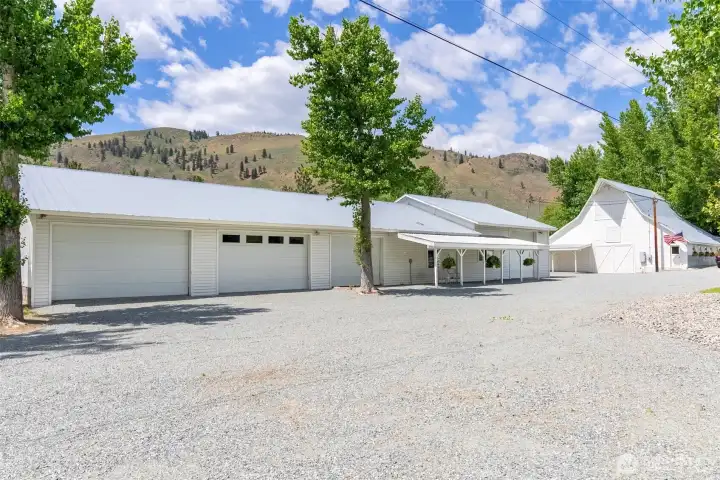 Large insulated shop and 4-bay garage with office and heated bath—ideal for storage, projects, or work-from-ranch life, all surrounded by quiet and privacy.