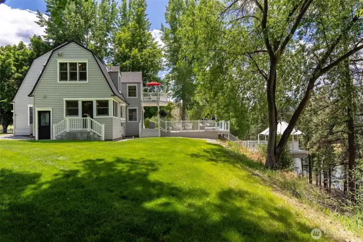 "From the farmhouse to the river's edge, thoughtfully designed outdoor spaces invite afternoons of entertaining, quiet reflection, and effortless enjoyment of the Methow River."