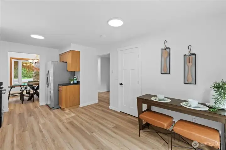 Kitchen/Dining Area – Flexible dining nook adjacent to the kitchen with ample room for casual meals and everyday living. Durable flooring continues throughout the space.