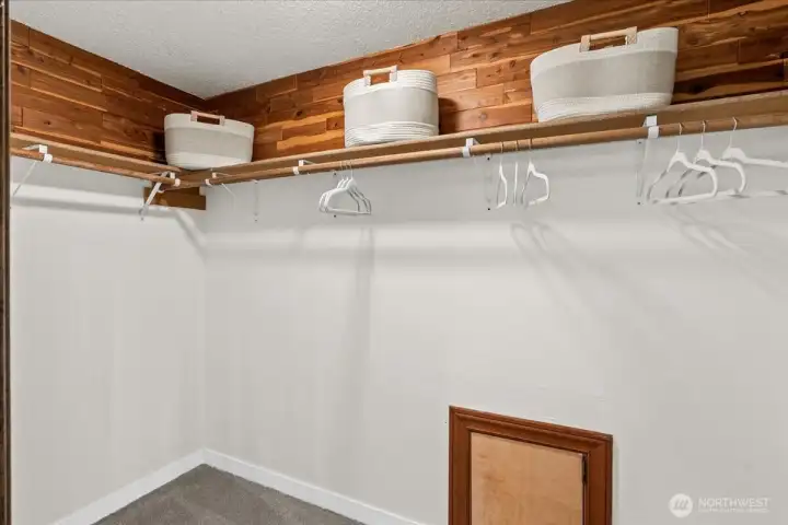 Walk-In Closet – Generous walk-in closet with built-in shelving and hanging space for organized storage.