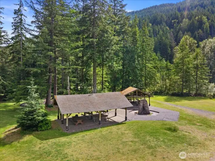 Community Picnic Area – Covered picnic shelter with seating and open green space, offering a convenient gathering area within the neighborhood.