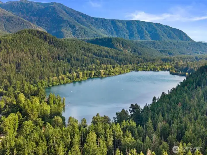 Area View – Scenic aerial view showcasing nearby Rattlesnake lake framed by forested hills and mountain vistas.
