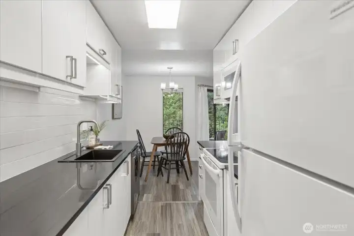 The kitchen is bright, clean and modern.