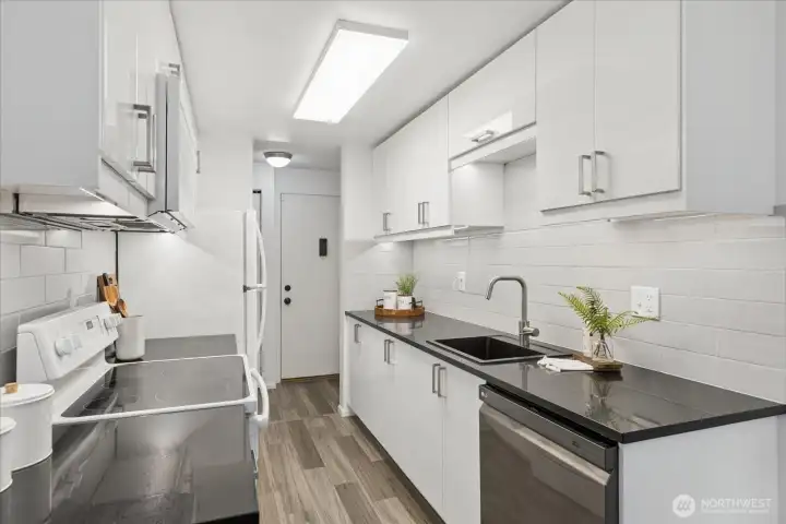 The galley kitchen has bright, open feel.