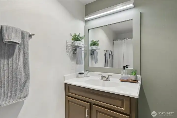 The bathroom has been refreshed and is just around the corner from the primary bedroom.