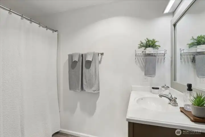 Full bathtub and shower.