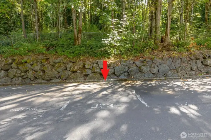 Unit J23 has one dedicated parking spot just across the parking lot from the unit itself.