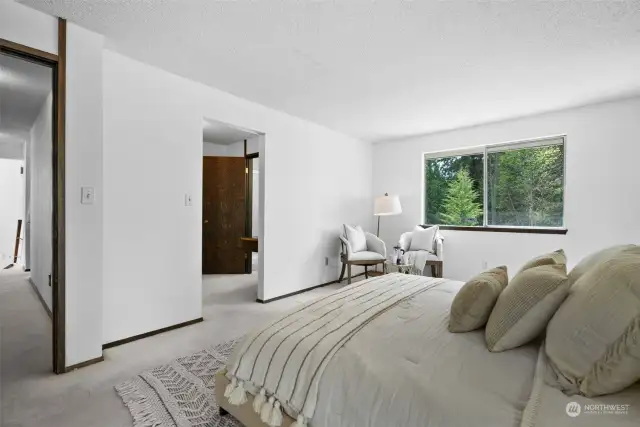 Several bedrooms on the upper floor are spacious with large windows contributing to the bright environment.