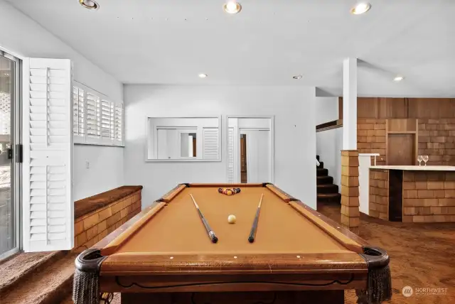 The recreational room includes the biliard table (if desired) with access to the backyard.