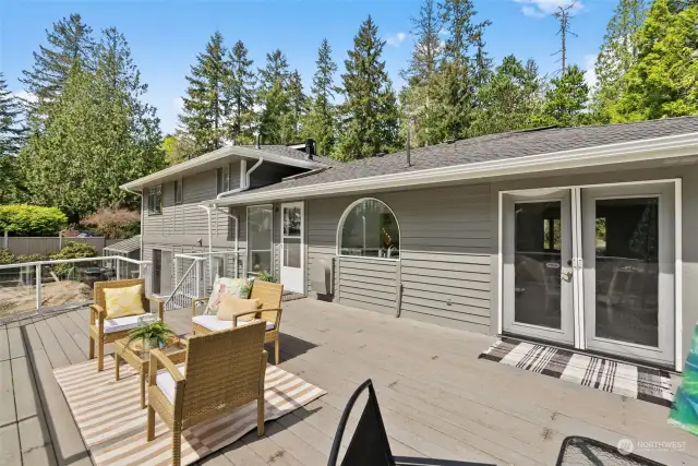 Experience the beauty of Pacific Northwest summers, where the sun shines daily. Enjoy seamless indoor/outdoor entertaining and use with deck access from both the kitchen and dining areas.