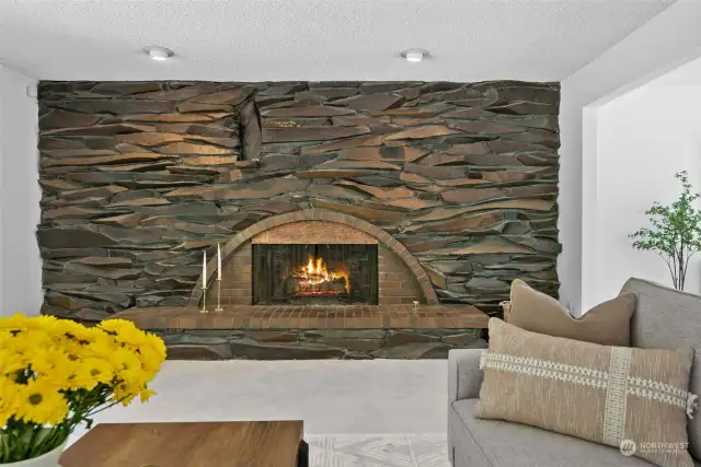 This home offers so many timeless features including this gorgeous stone wall surrounding the fireplace.