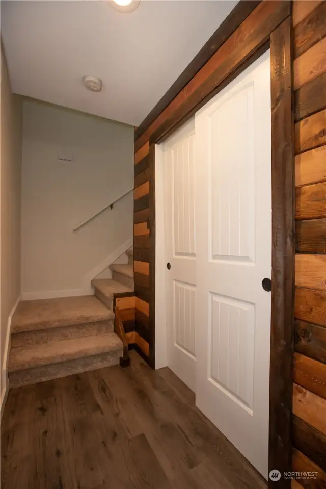 Gorgeous detailed wood coat closet right from the entrance