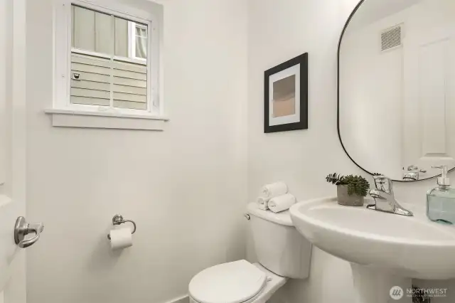 With a bathroom on every level, this home offers exceptional functionality and flexibility for any lifestyle.  This is the 1/2 bath on the main floor.