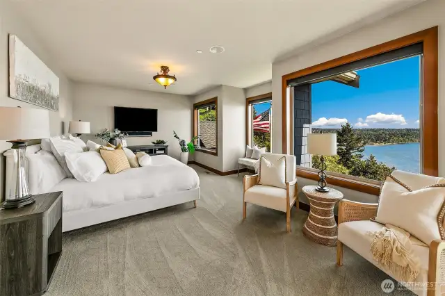 Primary suite is welcoming with all southern facing windows to capture Mt. Rainier and those morning sunrises.
