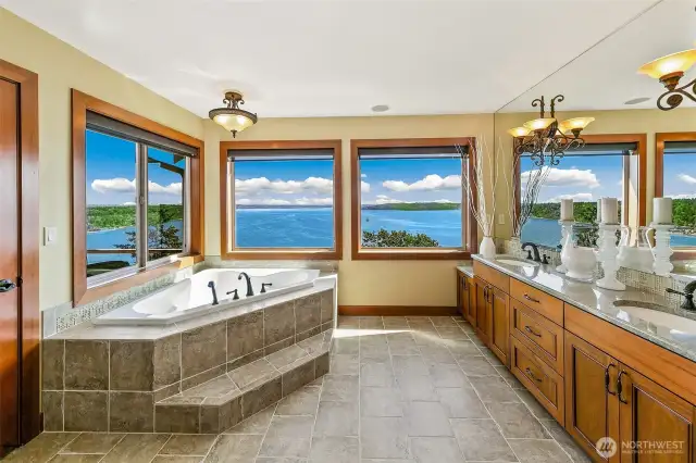 The primary bathroom doesn't lack any view,  With these three windows you see it all.  Perched above Puget Sound, most say these are better views than waterfront properties.