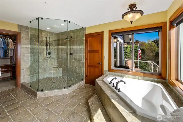 Primary bathroom boasts large soaking tub and shower for two.  Walk-in closet with plenty of space for his and her items.  Skylight for extra natural lighting.