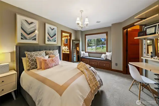 Second bedroom on the upper 2nd floor level.  Offers window seat, walk-in closet with custom built-in system and deck system by ELF. This bedroom has a Jack n Jill bathroom set up.