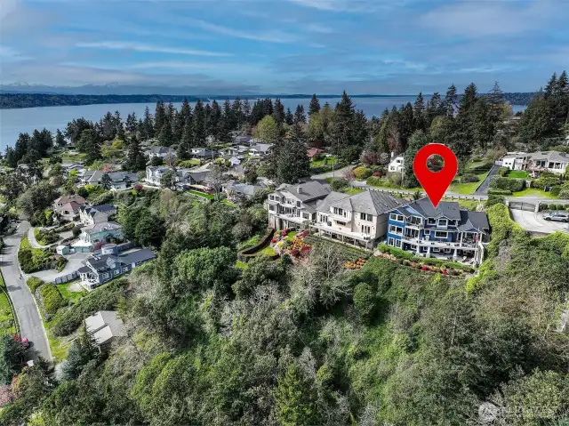 Nestled on the top of Three Tree Point on a private lane with views to Mt. Rainier and west to Vashon Island.