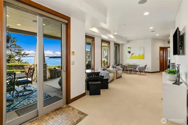 Slider off the family room to the covered patio with views as well.  This space is such a great flex space, could be used for family room, reading and relaxing space, excellent for a playroom and even a piano space! Some storage on this lower level here too.