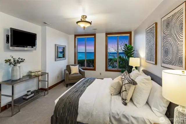 Lower level guest suite with stunning views of the Puget Sound and the sunsets.  Has a large side by side closet with full built-in system. Full bathroom attached.  This could be a second Primary bedroom.