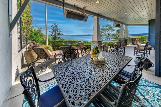 Another view of the full lower level covered patio space. Showing off the heaters, lighting and uncovered space for enjoying the warm summer days.