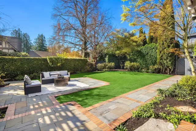Privacy abounds in backyard with turf, stone patio perfect for  play,pets and entertaining!