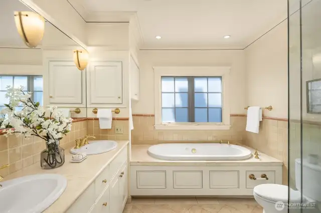 Ensuite bath has heated floors, vanity with double sinks, soaking tub and separate shower.