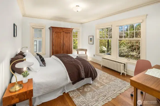 Southwest bedroom overlooks lush backyard.